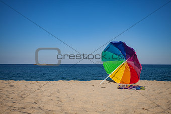 Rainbow Colored Sun Umbrella Beach
