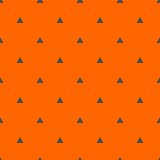 Tile vector pattern with black triangles on orange background