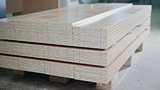Stack of wood particleboard panels on the warehouse or factory
