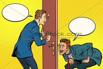 Two men spy each other through the door
