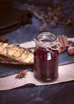 glass jar with raspberry jam
