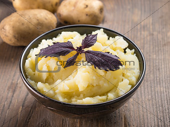 Mashed potatoes on wooden background