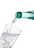 Pouring sparkling mineral water from bottle