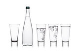 Bottle and glasses with healthy still clear water