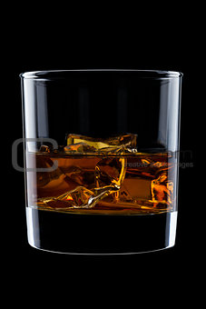 Elegant glass of whiskey with ice cubes