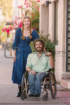 Woman with Braids and Man in Wheelchair