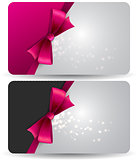 Holiday gift card  with pink ribbons and bow.