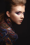 Portrait of beautiful young girl with glamorous evening makeup