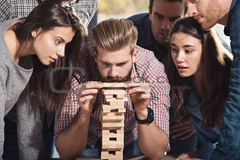 Team of business people build a wooden construction. concept of teamwork ,partnership and company startup