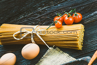 Pasta ingredients on wood