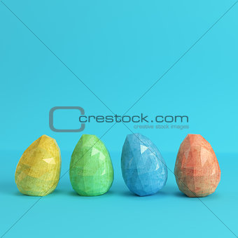 Colorfull easter eggs on bright blue background in pastel colors