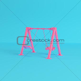 Red children swing on bright blue background in pastel colors