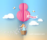 Woman in basket of hot air balloon