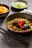 Soba noodles with beef and chopsticks