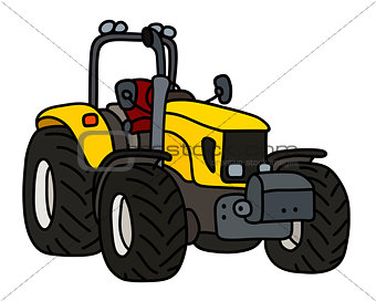 The yellow small tractor