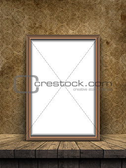 3D picture frame on a wooden table against a grunge damask style