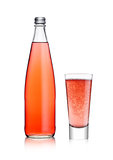 Bottle and glass of sparkling pink soda lemonade