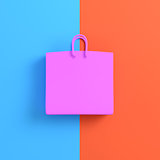 Pink shopping bag on bright blue orange background