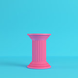 Pink ancient pillar on bright blue background in pastel colors