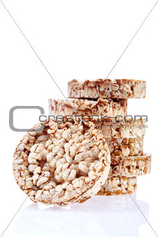 Round wheat crispbread, white background. Composition of crispbread on white background.