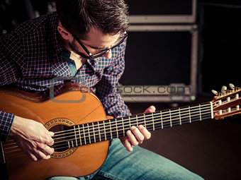 Guitarist playing acoustic guitar