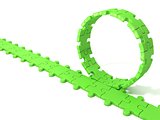 Green puzzle ring rotating over puzzle chain