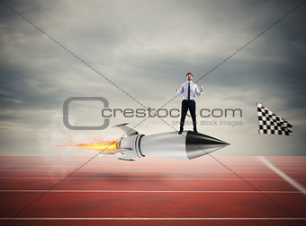 Winner businessman over a fast rocket. Concept of business competition