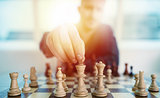 Businessman play with chess game. concept of business strategy and tactic