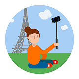 Traveler girl makes selfie by Eiffel tower