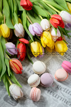 Colorful macaroons and tulips