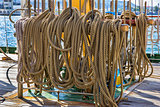 Old fashioned harbor marina sail boat ropes. Yachting details and objects concept.
