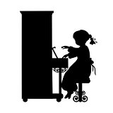 Silhouette girl music plays the piano