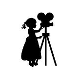 Silhouette girl makes movies film camera