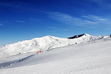 Ski slope at sun day
