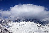 Mount Ushba in clouds at winter