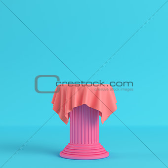 Cloth on a pedestal on bright blue background in pastel colors