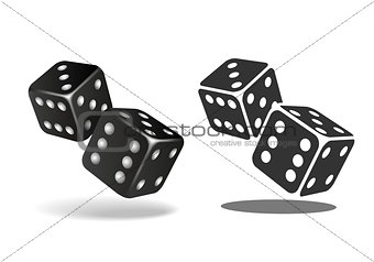 Two black falling dice isolated on white.