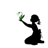 Silhouette girl with spring snowdrops
