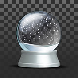 Snow globe with falling snowflakes.