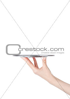 Female hand holds stainless steel catering tray