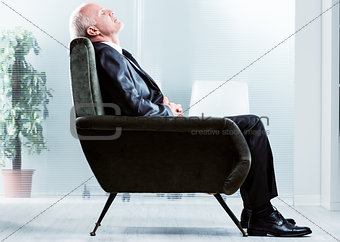 Tired businessman taking a moment to relax