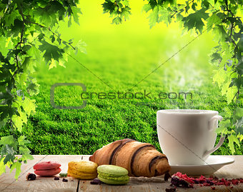 White cup and macaroons
