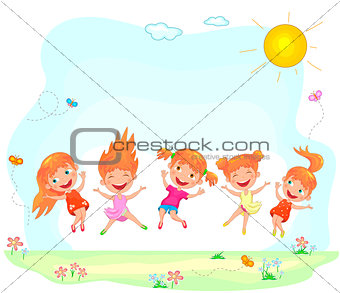 Joyful and happy children jumping on the grass