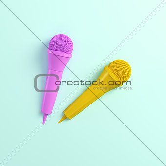 Pink and yellow microphones on bright background