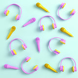 Headphones and microphones on bright background