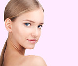 Beauty Woman face Portrait. Skin Care Concept Isolated on a pink background