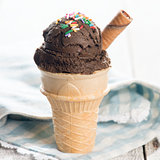 Brown ice cream in waffle cone 