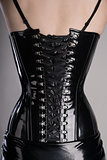 Back view of sexy woman in black corset 