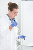Research operator preparing samples in petri dishes