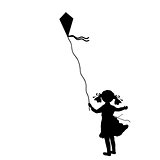 Silhouette girl flying kite summer